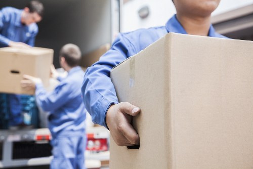 Professional movers handling household items during a Sidcup move