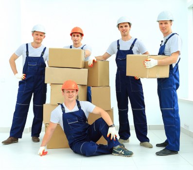 Moving boxes and furniture prepared for a commercial office move