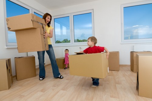 Team member handling furniture safely during a man with a van move