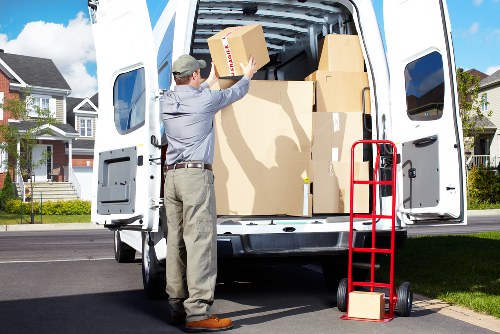Man with van loading furniture for a local move in Sidcup