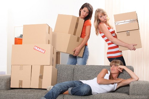 Family preparing boxes for a house move in Sidcup
