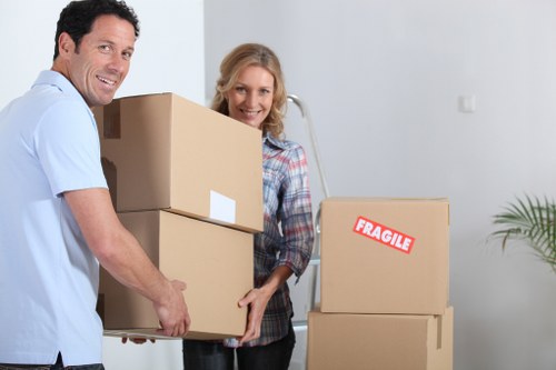 Removal team handling desks and office equipment safely